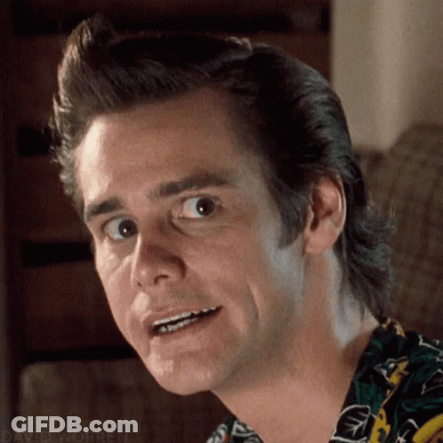 A Close Up Of A Man Making A Funny Face While Wearing A Colorful Shirt . GIF