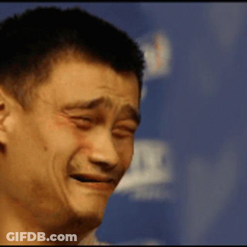 A Close Up Of A Man Making A Funny Face With A Blue Background GIF