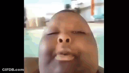 A Close Up Of A Man Making A Funny Face With His Eyes Closed GIF