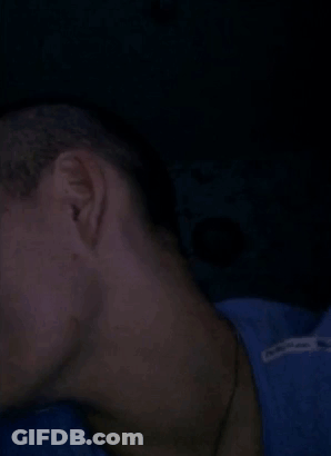 A Close Up Of A Man Making A Funny Face With His Eyes Closed And His Mouth Open . GIF