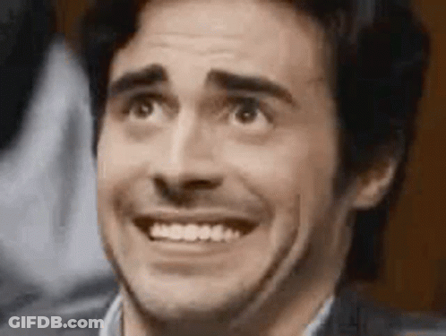 A Close Up Of A Man Making A Funny Face With His Mouth Open . GIF