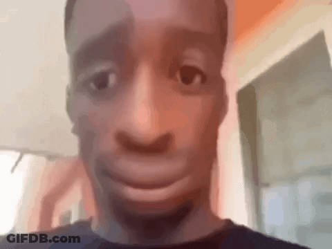 A Close Up Of A Man Making A Funny Face With His Mouth Open . GIF