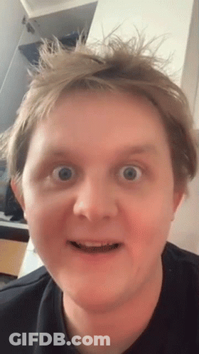A Close Up Of A Man Making A Funny Face With His Mouth Open GIF
