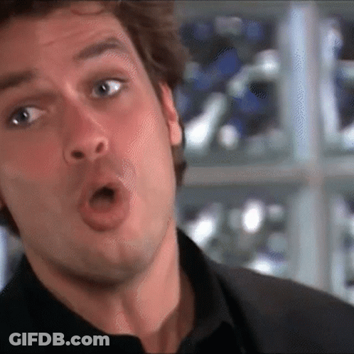A Close Up Of A Man Making A Funny Face With His Mouth Open GIF