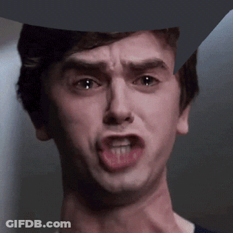 A Close Up Of A Man Making A Funny Face With His Mouth Open GIF