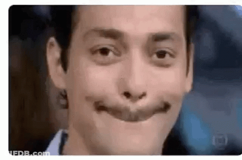 A Close Up Of A Man Making A Funny Face With His Mouth Wide Open . GIF