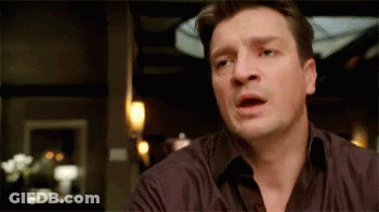 A Close Up Of A Man Making A Surprised Face GIF