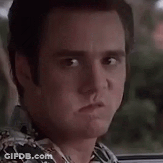 A Close Up Of A Man Making A Surprised Face While Sitting In A Car . GIF