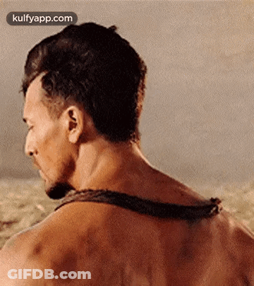 A Close Up Of A Man 'S Back With A Rope Around It . GIF