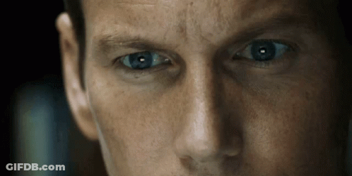 A Close Up Of A Man 'S Blue Eyes Looking At The Camera GIF