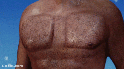 A Close Up Of A Man 'S Chest With Hair On It GIF