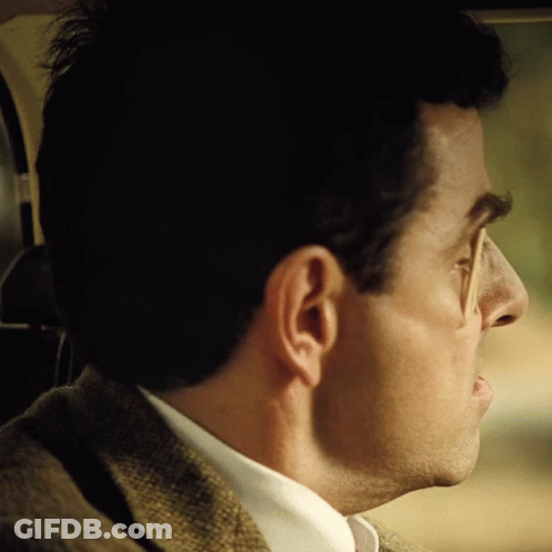A Close Up Of A Man 'S Ear And Nose In A Car GIF