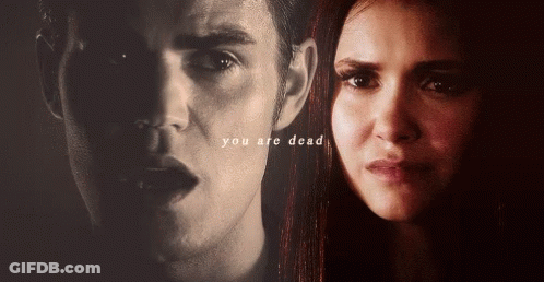 A Close Up Of A Man 'S Face And A Woman 'S Face With The Words You Are Dead Above Them GIF