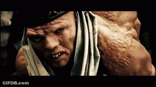 A Close Up Of A Man 'S Face And Arm GIF
