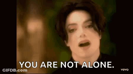 A Close Up Of A Man 'S Face And The Words `` You Are Not Alone '' . GIF