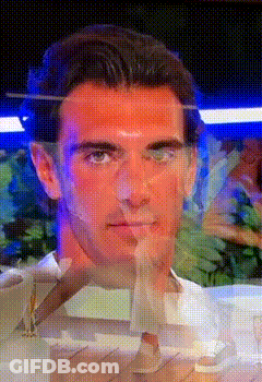 A Close Up Of A Man 'S Face Behind A Glass Covering GIF
