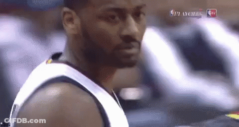 A Close Up Of A Man 'S Face During A Basketball Game On Tv GIF