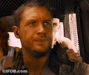 A Close Up Of A Man 'S Face In A Car Looking At The Camera . GIF