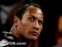 A Close Up Of A Man 'S Face In A Dark Room GIF