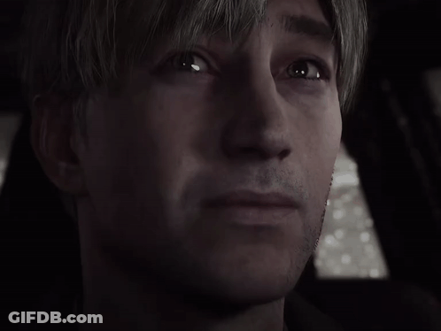 A Close Up Of A Man 'S Face In A Dark Room . GIF