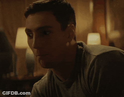 Close Up Of Man's Face In Dark Room GIF