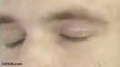 A Close Up Of A Man 'S Face In A Green Circle GIF