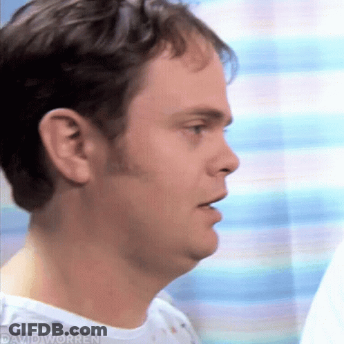 A Close Up Of A Man 'S Face In A Hospital Gown GIF
