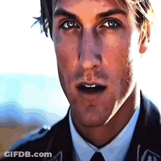 A Close Up Of A Man 'S Face In A Suit And Tie GIF