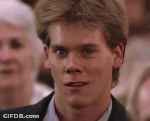 A Close Up Of A Man 'S Face In A Suit GIF