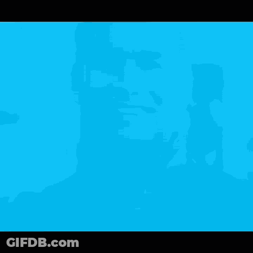 A Close Up Of A Man 'S Face In Blue GIF