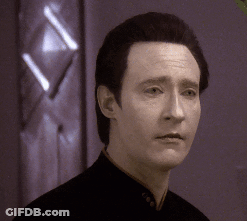 A Close Up Of A Man 'S Face In Front Of A Door GIF