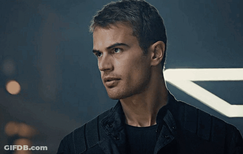 A Close Up Of A Man 'S Face In Front Of A Light GIF