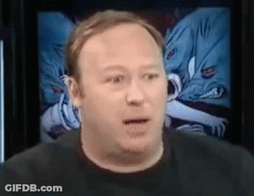 A Close Up Of A Man 'S Face In Front Of A Screen GIF