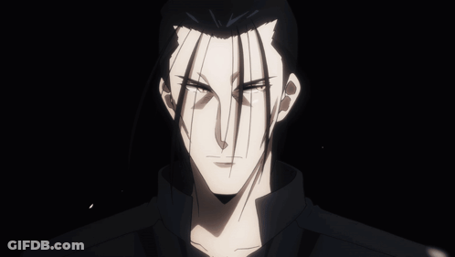A Close Up Of A Man 'S Face In The Dark GIF