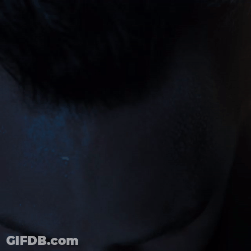 Man In Dark With Eyes Closed GIF