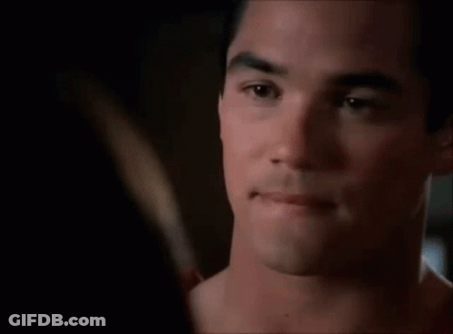 A Close Up Of A Man 'S Face Looking At A Woman 'S Face . GIF