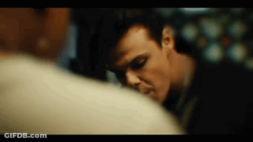 A Close Up Of A Man 'S Face Looking At Another Man 'S Face . GIF