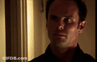 A Close Up Of A Man 'S Face Looking At The Camera GIF