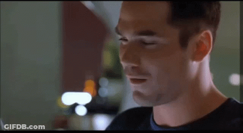 A Close Up Of A Man 'S Face Looking At The Camera GIF