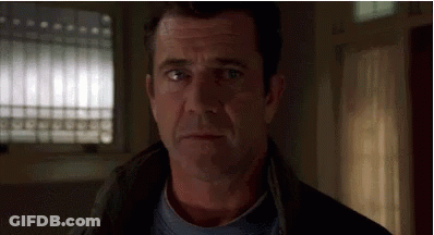 A Close Up Of A Man 'S Face Looking At The Camera . GIF