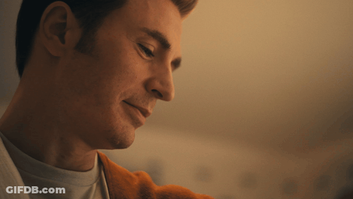 A Close Up Of A Man 'S Face Looking Down GIF
