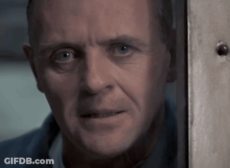 A Close Up Of A Man 'S Face Looking Out A Window GIF