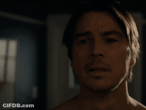 A Close Up Of A Man 'S Face Looking Out A Window GIF