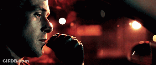 A Close Up Of A Man 'S Face Looking Out Of A Car Window GIF