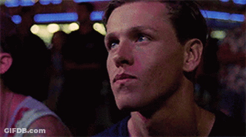 A Close Up Of A Man 'S Face Looking Up At Something GIF