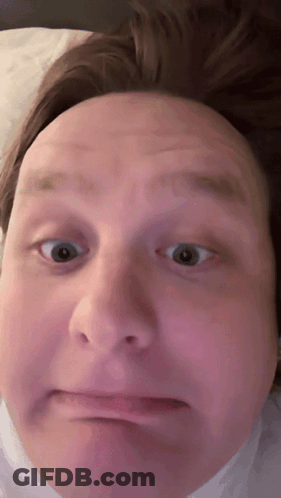 A Close Up Of A Man 'S Face Making A Face GIF