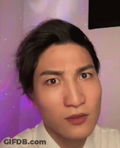 A Close Up Of A Man 'S Face Making A Funny Face GIF