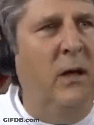 A Close Up Of A Man 'S Face Making A Funny Face . GIF