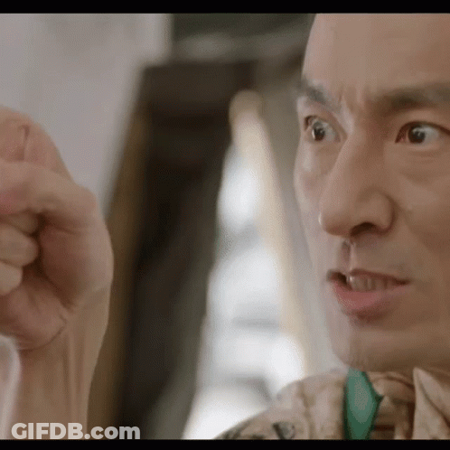 A Close Up Of A Man 'S Face Making A Funny Face GIF