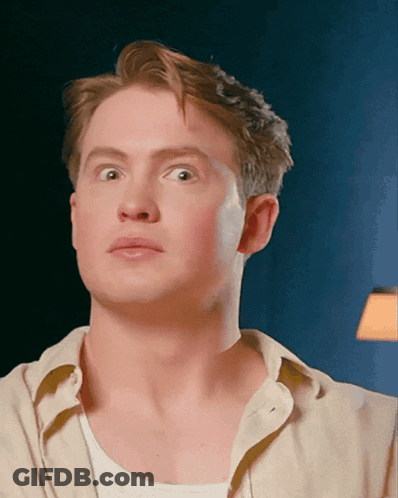 A Close Up Of A Man 'S Face Making A Funny Face GIF